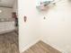 Empty laundry room featuring wood floors, neutral walls, and wire shelves at 8183 Sultana Cir, Charlotte, NC 28227