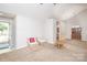 Bright living room with neutral carpet and decor, offering a comfortable and inviting space at 8183 Sultana Cir, Charlotte, NC 28227