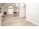 Open-concept living area with carpet, fireplace and French doors at 8183 Sultana Cir, Charlotte, NC 28227