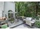 Inviting deck features dining area, stainless steel grill and lush backyard at 8219 Beardsley Dr, Charlotte, NC 28269