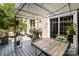 Inviting outdoor deck features dining area, grill and sliding door access at 8219 Beardsley Dr, Charlotte, NC 28269