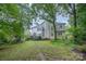 Expansive backyard with mature trees providing ample shade and privacy, excellent for relaxing at 8219 Beardsley Dr, Charlotte, NC 28269