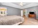 Bright primary bedroom boasts neutral colors, carpet flooring, and walk-in closet at 8219 Beardsley Dr, Charlotte, NC 28269