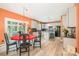 Eat-in kitchen with stainless steel appliances, stone countertops, tile backsplash, and ample storage space at 8219 Beardsley Dr, Charlotte, NC 28269