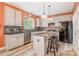 Modern kitchen with stainless steel appliances, center island, wood floors, and plenty of cabinet space at 8219 Beardsley Dr, Charlotte, NC 28269