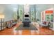 Spacious living room boasts high ceilings, a pool table, fireplace, and lots of natural light from the large windows at 8219 Beardsley Dr, Charlotte, NC 28269