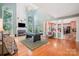 Spacious living room with a pool table, fireplace, and high ceilings at 8219 Beardsley Dr, Charlotte, NC 28269