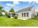 The backyard features a well-maintained lawn, fence, and a screened porch that extends from the home at 867 Pecan Tree Ln, Fort Mill, SC 29715