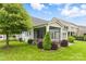 Cozy screened porch is surrounded by landscaping at 867 Pecan Tree Ln, Fort Mill, SC 29715