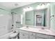 A well-lit bathroom with a double sink vanity, a large mirror, and a shower-tub combination at 867 Pecan Tree Ln, Fort Mill, SC 29715