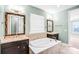 This primary bathroom features dual vanities and a large soaking tub at 867 Pecan Tree Ln, Fort Mill, SC 29715