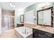 This primary bathroom features dual vanities, a soaking tub, and a tiled shower at 867 Pecan Tree Ln, Fort Mill, SC 29715