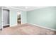 Bright bedroom with carpet flooring offering a view into an ensuite bathroom with tub at 867 Pecan Tree Ln, Fort Mill, SC 29715