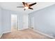 A serene bedroom with neutral walls, plush carpeting, and a closet at 867 Pecan Tree Ln, Fort Mill, SC 29715