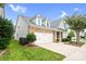 Well-maintained home exterior featuring brick and vinyl siding, a two-car garage, and green lawn at 867 Pecan Tree Ln, Fort Mill, SC 29715