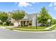 Attractive home exterior with a manicured lawn, mature trees, and a welcoming entrance at 867 Pecan Tree Ln, Fort Mill, SC 29715