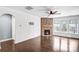 Cozy living room features a stone fireplace, hardwood floors, and shiplap walls at 867 Pecan Tree Ln, Fort Mill, SC 29715