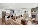Spacious open-concept living room with hardwood floors, stone fireplace and comfortable seating at 867 Pecan Tree Ln, Fort Mill, SC 29715