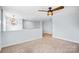 A cozy loft featuring plush carpeting, a decorative light fixture, and a modern ceiling fan at 867 Pecan Tree Ln, Fort Mill, SC 29715