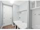 A well-lit mud room with convenient coat hooks, built-in storage, and ample counter space at 867 Pecan Tree Ln, Fort Mill, SC 29715