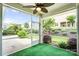 A bright screened porch with an artificial turf floor and a view of the yard at 867 Pecan Tree Ln, Fort Mill, SC 29715