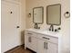 Stylish bathroom features a double sink vanity with modern fixtures and two framed mirrors at 905 Gantt St, Kings Mountain, NC 28086