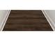 Close-up of dark wood flooring with white baseboards at 905 Gantt St, Kings Mountain, NC 28086