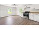 Bright, eat-in kitchen featuring stainless steel appliances, and gorgeous flooring at 905 Gantt St, Kings Mountain, NC 28086