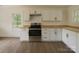 Modern kitchen featuring white cabinets, stainless steel appliances, and butcher block countertops at 905 Gantt St, Kings Mountain, NC 28086