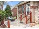 Charming back patio with brick accents, offers a peaceful outdoor seating area for relaxation and entertaining guests at 9112 Butterfly Ct, Gastonia, NC 28056