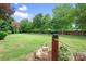 Spacious backyard with manicured lawn and garden bed at 9112 Butterfly Ct, Gastonia, NC 28056
