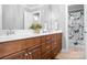 Bright bathroom featuring a dual sink vanity, decorative accents, and a shower with Paris-themed curtain at 9112 Butterfly Ct, Gastonia, NC 28056