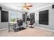 Spacious bedroom features carpet floors, two desk setups, acoustic sound dampeners, and natural light at 9112 Butterfly Ct, Gastonia, NC 28056