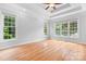 Bright and airy bedroom with large windows and hardwood floors at 9112 Butterfly Ct, Gastonia, NC 28056