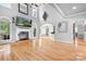 Spacious living room with a fireplace, hardwood floors, and an open floor plan, ideal for gatherings at 9112 Butterfly Ct, Gastonia, NC 28056