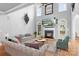 Inviting living room with sofas, area rug, fireplace, and media console, creating a warm and cozy space at 9112 Butterfly Ct, Gastonia, NC 28056