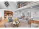 Staged living room with comfortable seating, area rug, and view of the dining area at 9112 Butterfly Ct, Gastonia, NC 28056