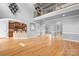 Spacious open-concept living area with hardwood floors, high ceilings, and natural light at 9112 Butterfly Ct, Gastonia, NC 28056