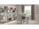 Bright home office with a desk, modern shelving and decor, and natural light from the large window at 10116 Florentine Way, Charlotte, NC 28214