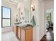 Bathroom featuring double vanity with granite countertops and a view of the bedroom at 956 Warren Burgess Ln, Charlotte, NC 28205