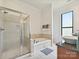 Bright bathroom featuring a glass shower, soaking tub, and dual sinks with granite countertops at 956 Warren Burgess Ln, Charlotte, NC 28205