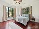 Spacious bedroom with large windows providing plenty of natural light and hardwood flooring at 956 Warren Burgess Ln, Charlotte, NC 28205