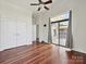 Bedroom featuring gorgeous hardwood floors, a ceiling fan, and a sliding glass door at 956 Warren Burgess Ln, Charlotte, NC 28205