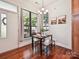 Cozy dining area bathed in light, features hardwood floors and stylish decor at 956 Warren Burgess Ln, Charlotte, NC 28205