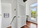 Bright hallway with hardwood floors and access to an outdoor balcony at 956 Warren Burgess Ln, Charlotte, NC 28205