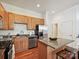 Well-maintained kitchen with stainless appliances, granite countertops and island seating at 956 Warren Burgess Ln, Charlotte, NC 28205
