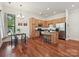 Bright open kitchen featuring hardwood floors, an island and stainless steel appliances at 956 Warren Burgess Ln, Charlotte, NC 28205