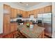 Well-equipped kitchen featuring granite countertops, stainless steel appliances and a center island at 956 Warren Burgess Ln, Charlotte, NC 28205