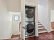 Convenient laundry closet on the stair landing featuring a modern washer and dryer unit at 956 Warren Burgess Ln, Charlotte, NC 28205
