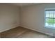 Cozy bedroom offers natural light and neutral carpeting at 9730 Tea Garden Dr, Gastonia, NC 28056